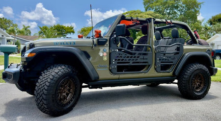 Mesh tube doors with rear-view mirrors installed on a Jeep Wrangler